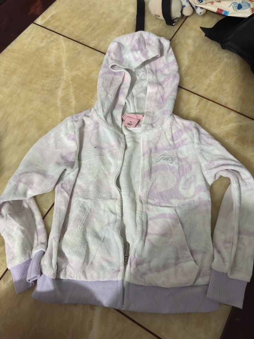 Juicy Couture Velour Hoodie Tie-Dye Lilac White (Category: Coats, Jackets and Outerwear) located in Manila. Submitted by jessj30 (Listing ID 1442263493, Image 1). Description: - Soft velour Juicy Couture hoodie - Trendy lilac and white tie-dye pattern - Convenient zip-up front with pockets - Ribbed cuffs and hem for a comfortable fit - Ideal for everyday casual wear.