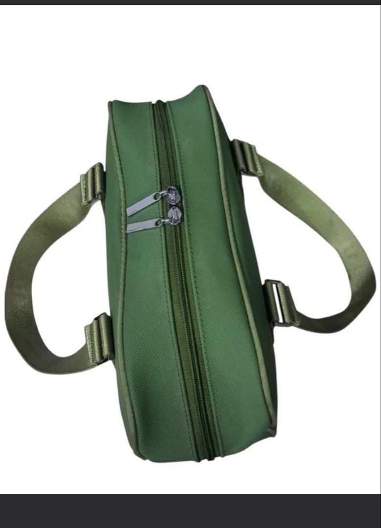 Lacoste Green Duffel Bag (Category: Luxury Bags & Wallets) located in Manila. Submitted by devorahlop39116 (Listing ID 1442215385, Image 3). Description: - Green Lacoste duffel bag - Lacoste logo detail on straps - Zippers are in good working condition - Interior features a small pocket with a clip - Ideal size for weekend getaways or gym sessions - Bag is clean outside Only issue is my few stains sa loob Buyer will shoulder the shipping fee Last