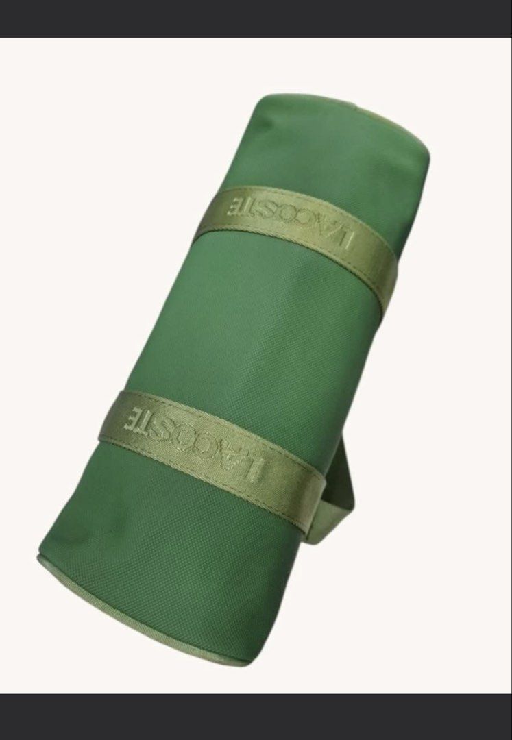 Lacoste Green Duffel Bag (Category: Luxury Bags & Wallets) located in Manila. Submitted by devorahlop39116 (Listing ID 1442215385, Image 2). Description: - Green Lacoste duffel bag - Lacoste logo detail on straps - Zippers are in good working condition - Interior features a small pocket with a clip - Ideal size for weekend getaways or gym sessions - Bag is clean outside Only issue is my few stains sa loob Buyer will shoulder the shipping fee Last