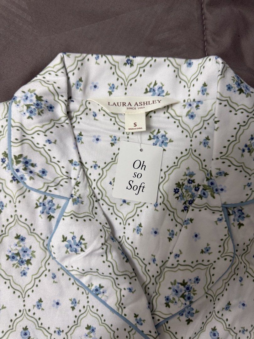 Laura Ashley Blue Floral Pajama Set Size S (Category: New Undergarments & Loungewear) located in Selayang. Submitted by prelovebyft (Listing ID 1442297466, Image 3). Description: - Laura Ashley pajama set - Size: S - Includes: Button-down top with chest pocket and short pants - Material: Soft and comfortable 72% Polyester 27% Rayon 1% Spandex - Condition: New with tags - Perfect for a cozy night’s sleep - S size fits 60kg below.