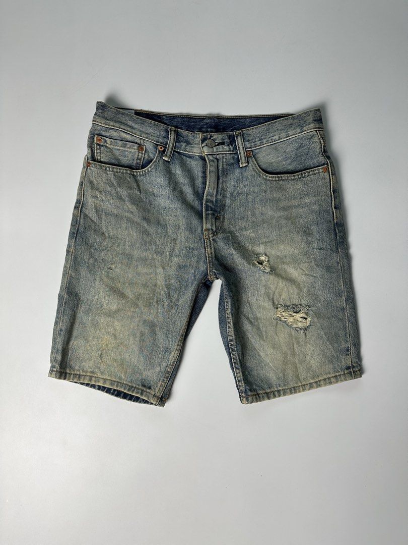 Levis 502 W32 Tattered Denim Shorts (Category: Shorts) located in Mabalacat. Submitted by shiroe14 (Listing ID 1442255476, Image 1). Description: - Brand: Levis - Model: 502 - Size: W32 - Style: Tattered Denim Shorts - Color: Light Blue Wash - Features: Tattered details, iconic Levis branding - Issue: minimal stain - Dimes(inches): 34 waist x 20 length x 9 leg open.