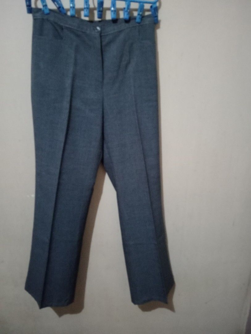 Liberté Grey Trousers (Category: Other Bottoms) located in Makati City. Submitted by YSL80022 (Listing ID 1442233111, Image 1). Description: - Brand: Liberté - Color: Grey - Style: Classic cut trousers - Closure: Button and zip front - Pockets: Two side pockets - Material: Durable blend (ideal for everyday wear) - Versatility: Suitable for both work and casual occasions - Key Feature: A great staple piece for any wardrobe RFS: weight gain.