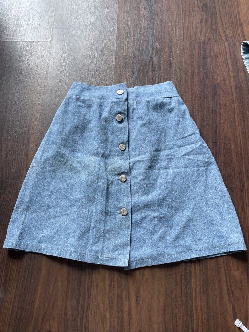 Light Wash Denim Button-Front A-Line Skirt (Category: Skirts) located in Quezon City. Submitted by andreaaa_______ (Listing ID 1442247516, Image 1). Description: - Cute light wash denim skirt - Button-front closure - Elasticated back waistband for comfort - Flattering A-line silhouette measurements in photo no lining/inner shorts buttons can actually be unbottoned.