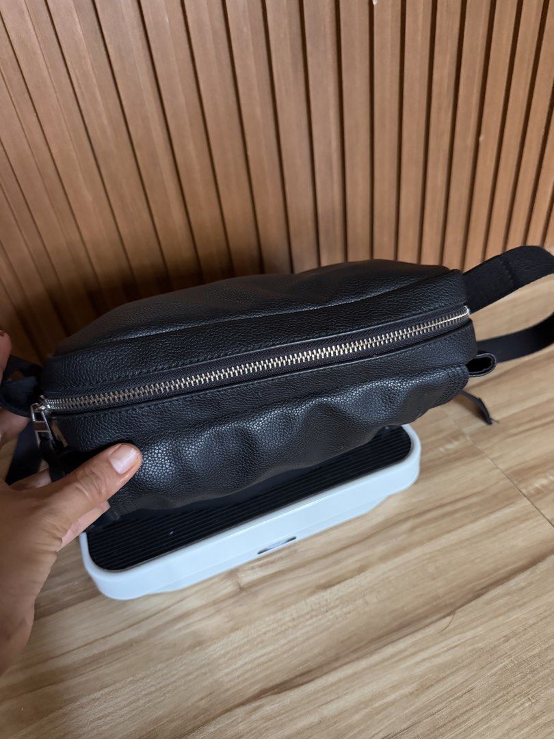 Loewe Black Leather Crossbody Bag (Category: Luxury Bags & Wallets) located in Danao, Cebu. Submitted by anne_2016143 (Listing ID 1442204195, Image 2). Description: - Black pebbled leather crossbody bag - Secure zip closure on top - Adjustable strap for comfortable wear - Interior: 1 main compartment, 1 smaller pocket - Stylish silver hardware - Ideal for everyday use.