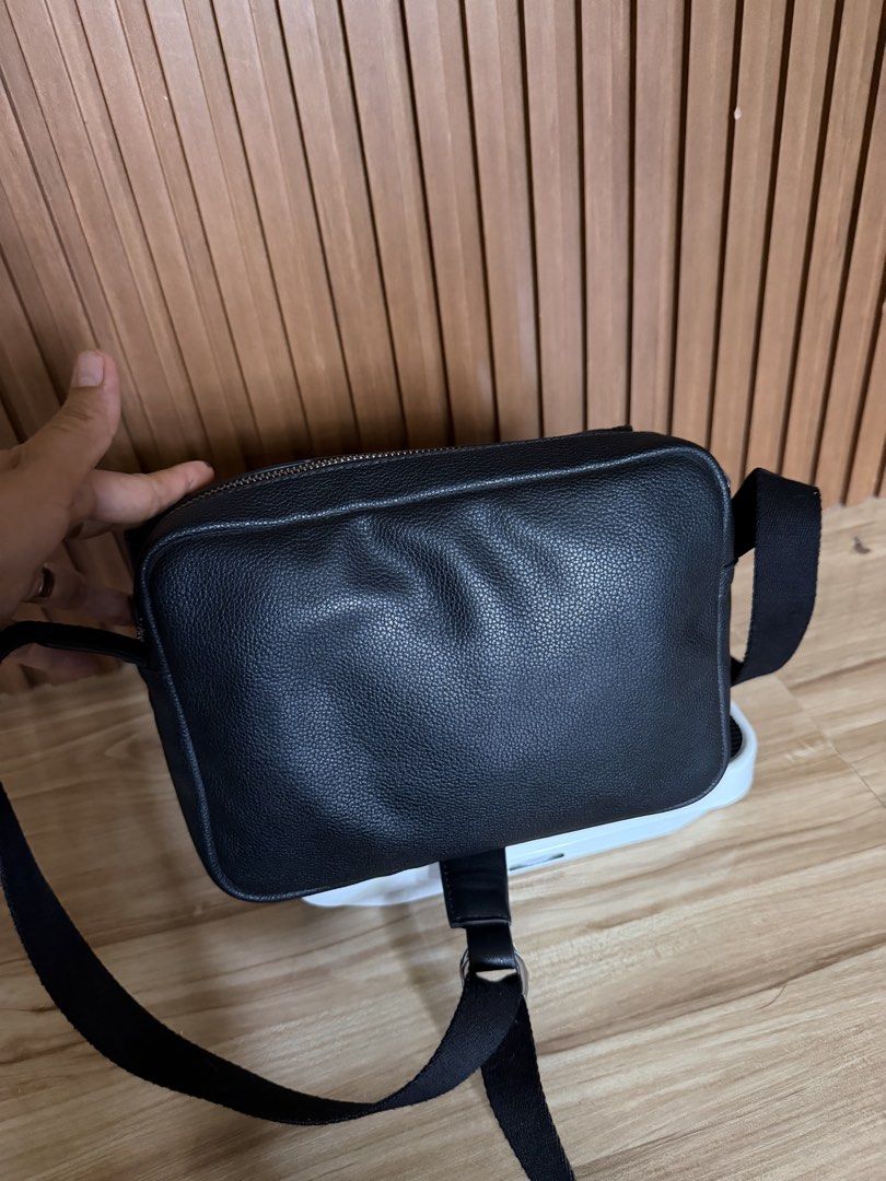 Loewe Black Leather Crossbody Bag (Category: Luxury Bags & Wallets) located in Danao, Cebu. Submitted by anne_2016143 (Listing ID 1442204195, Image 3). Description: - Black pebbled leather crossbody bag - Secure zip closure on top - Adjustable strap for comfortable wear - Interior: 1 main compartment, 1 smaller pocket - Stylish silver hardware - Ideal for everyday use.