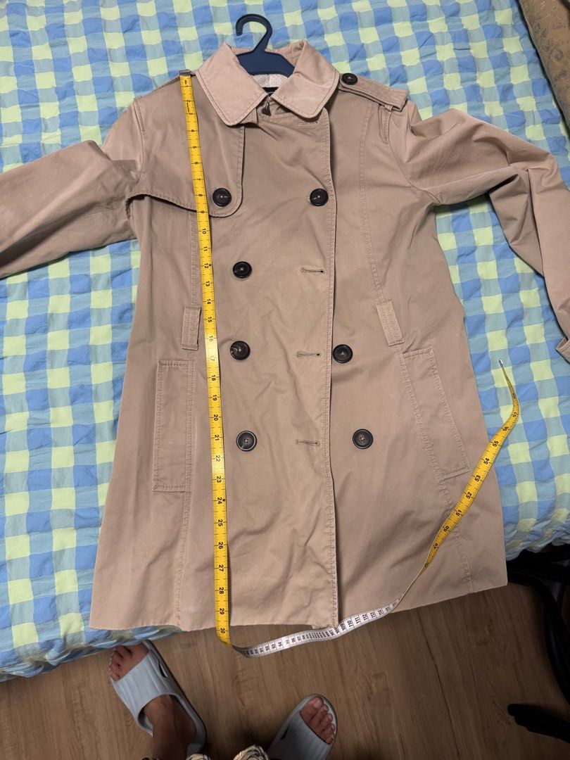 Massimo Dutti Beige Double-Breasted Trench Coat (Category: Coats, Jackets and Outerwear) located in Taguig. Submitted by ferrycat (Listing ID 1442286835, Image 2). Description: - Classic beige trench coat from Massimo Dutti - Double-breasted with button closure - Includes a belt to cinch the waist - Versatile for casual or smart outfits - Measurements available in photos Tag cloud Black White Stripe Dress Striped Dress Black and White Dress Monoc