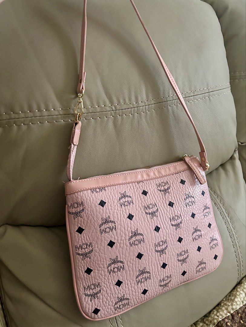 MCM Pink Monogram shoulder Bag (Category: Luxury Bags & Wallets) located in Quezon City. Submitted by asiaco (Listing ID 1442186629, Image 1). Description: Chic pink MCM shoulder bag with classic monogram. Features gold hardware, secure zipper, and adjustable strap. Perfect for daily essentials. Can also be an insert for your mcm tote bag, no tag inside. It is probably an insert. .
