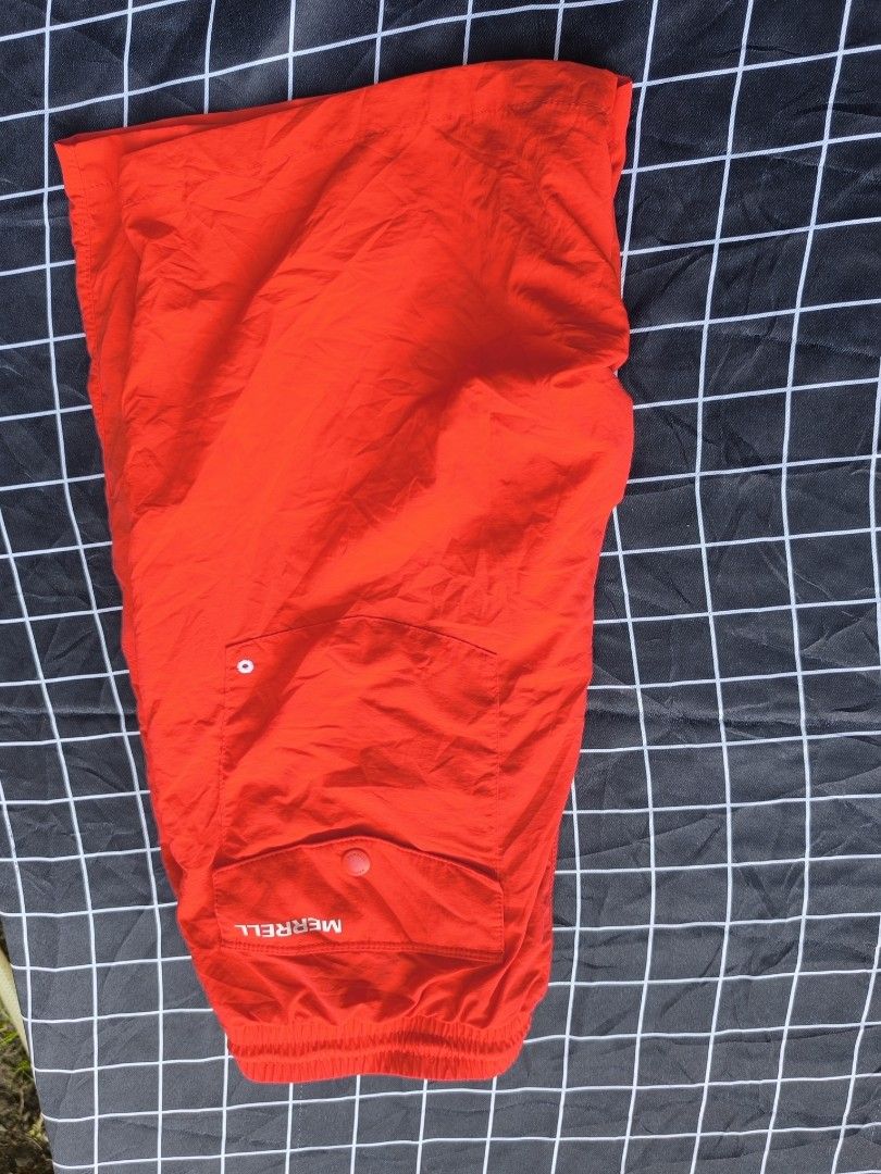 Merrell Red Athletic Shorts with Drawstring (Category: Shorts) located in Akbar. Submitted by gabriieeel (Listing ID 1442234162, Image 2). Description: - Merrell red athletic shorts - Elastic waistband with white drawstring - Two side pockets - Lightweight material, perfect for sports or casual wear - Minor creasing from storage (please check photos for details).