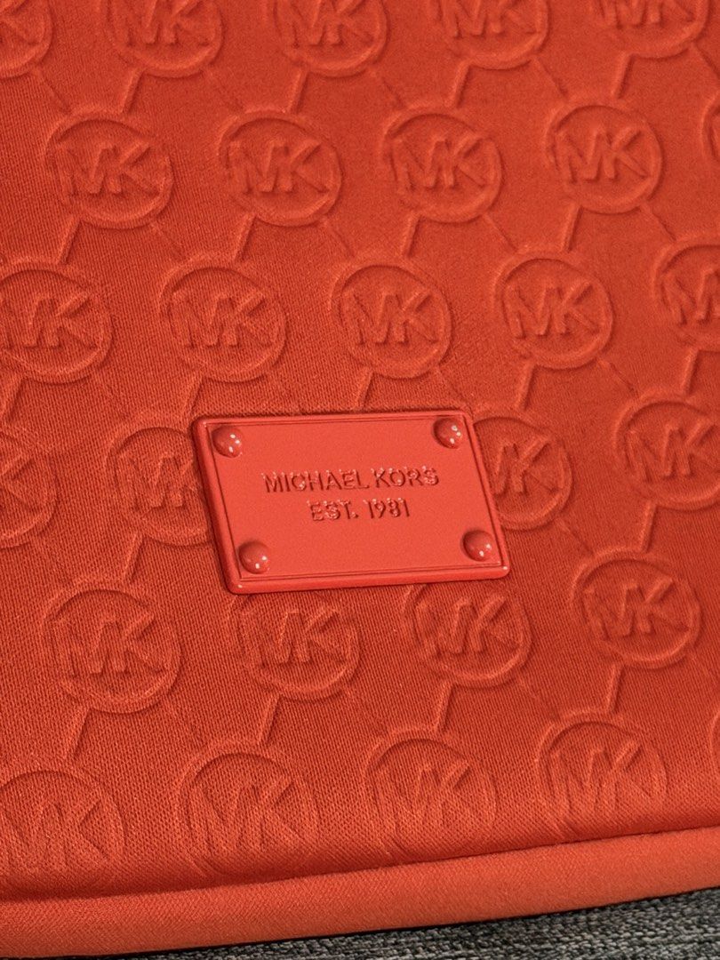 Michael Kors MK Tablet Case (Category: Cases & Sleeves) located in Paranaque City. Submitted by mareese1922 (Listing ID 1442248454, Image 3). Description: - Orange Michael Kors tablet sleeve - Ideal for protecting your tablet - Dimensions are in the photos - iPad mini for size reference only and NOT INCLUDED 😅 Loc: Paranaque.
