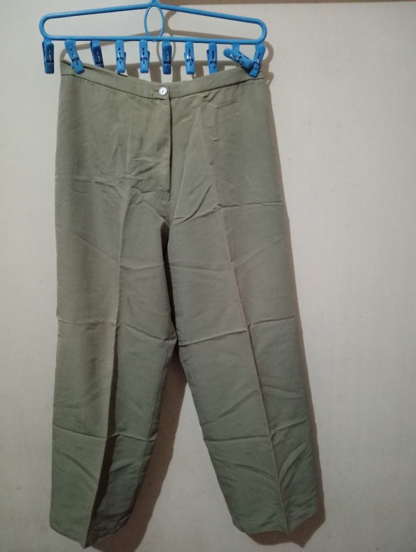 Military Green Trousers (Category: Other Bottoms) located in Makati City. Submitted by YSL80022 (Listing ID 1442237519, Image 1). Description: - Military colored trousers - Straight leg cut - Button and zip closure at the front - Two visible front pockets - Perfect for casual or work attire - Easy to style with various tops RFS: weight gain.