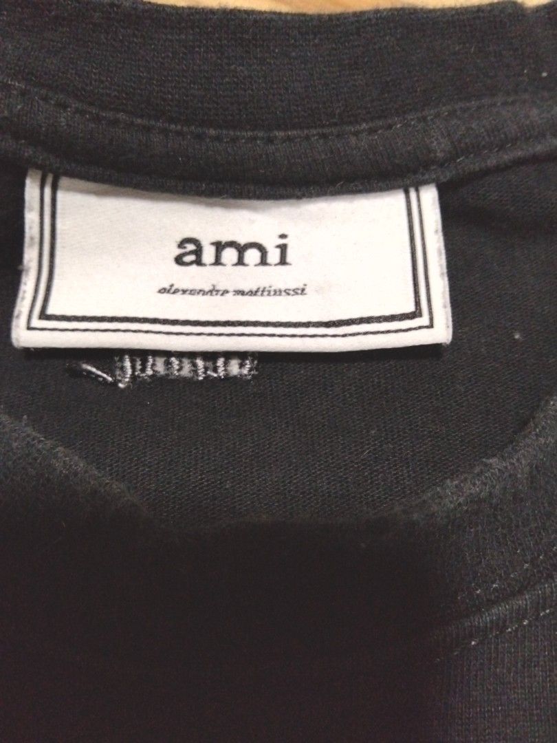 M-L Ami Tshirt black (Category: Tshirts & Polo Shirts ) located in Pasay City. Submitted by jerome23 (Listing ID 1442323871, Image 3). Description: size medium to large adult length 27 width 22.5 inches excellent condition color black 9.5/10 color rate.