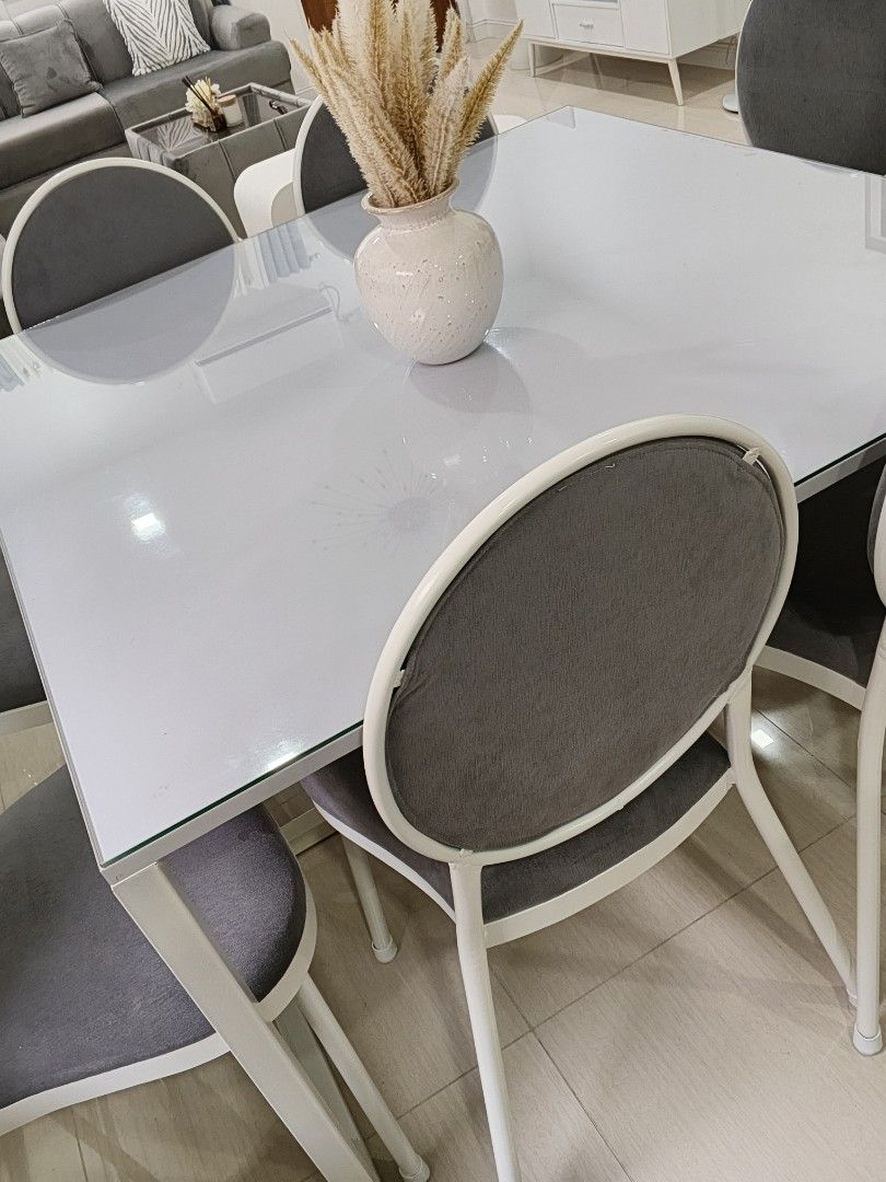Modern White Dining Table with 8 Gray Chairs (Category: Tables & Sets) located in Quezon City. Submitted by the_answer_3 (Listing ID 1442289318, Image 2). Description: - Sleek modern white dining table with white metal legs. - Includes 8 comfortable gray upholstered chairs with white metal frames. - Seats 6 people comfortably. - Ideal for family meals and entertaining guests. - Sold as a complete set. loc: Batasan Hills Q.C..