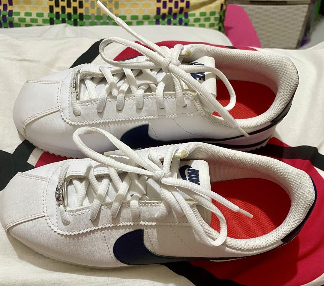 Nike Cortez White Navy Leather Sneakers (Category: Sneakers) located in Quezon City. Submitted by stuffsrus (Listing ID 1442342261, Image 2). Description: Classic white Nike Cortez sneakers with navy blue accents. Leather upper. Lace-up closure for a secure fit. Iconic silhouette. Great for everyday wear. These are a staple for any sneaker collection.almost new use only once.