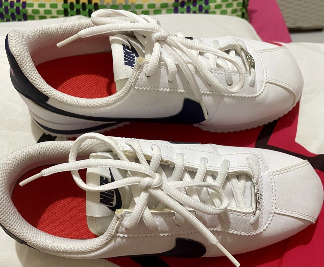 Nike Cortez White Navy Leather Sneakers (Category: Sneakers) located in Quezon City. Submitted by stuffsrus (Listing ID 1442342261, Image 3). Description: Classic white Nike Cortez sneakers with navy blue accents. Leather upper. Lace-up closure for a secure fit. Iconic silhouette. Great for everyday wear. These are a staple for any sneaker collection.almost new use only once.