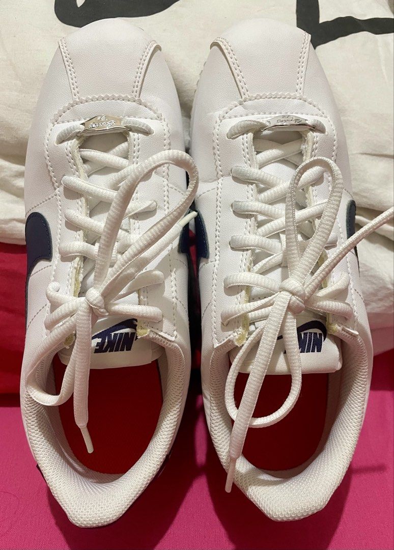 Nike Cortez White Navy Leather Sneakers (Category: Sneakers) located in Quezon City. Submitted by stuffsrus (Listing ID 1442342261, Image 1). Description: Classic white Nike Cortez sneakers with navy blue accents. Leather upper. Lace-up closure for a secure fit. Iconic silhouette. Great for everyday wear. These are a staple for any sneaker collection.almost new use only once.