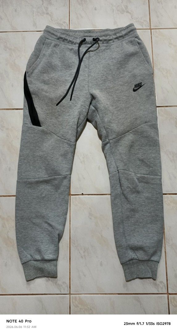 Nike Tech Fleece Grey Jogger Pants Size S (Category: Joggers) located in Manila. Submitted by jeffies4ti96921 (Listing ID 1442228545, Image 1). Description: - Grey Nike Tech Fleece joggers - Size S - Signature zip pocket detail - Drawstring waist for adjustable fit - Comfortable for everyday wear - Great for lounging or workouts.