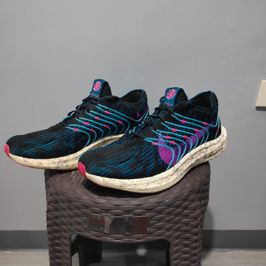 Nike ZoomX Running Shoes US 10 (Category: Sneakers) located in Quezon City. Submitted by iamfreduu (Listing ID 1442209413, Image 1). Description: - Nike ZoomX running shoes - Color: Black with blue and pink accents - Size: US 10 / UK 9 / EUR 44 - Origin: Made in Vietnam - Condition: Great for runs - Reason for selling: Friend clearing space.