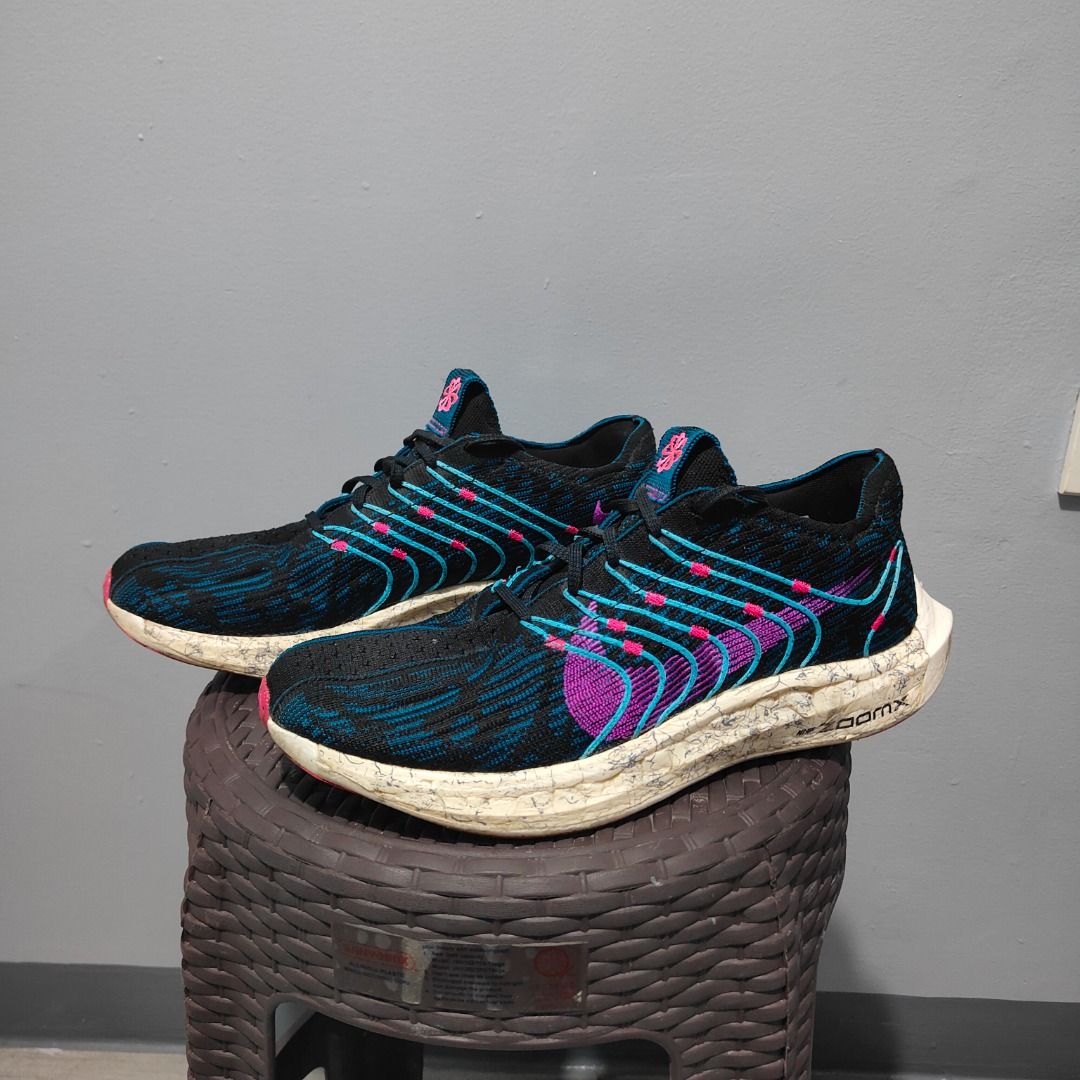 Nike ZoomX Running Shoes US 10 (Category: Sneakers) located in Quezon City. Submitted by iamfreduu (Listing ID 1442209413, Image 2). Description: - Nike ZoomX running shoes - Color: Black with blue and pink accents - Size: US 10 / UK 9 / EUR 44 - Origin: Made in Vietnam - Condition: Great for runs - Reason for selling: Friend clearing space.