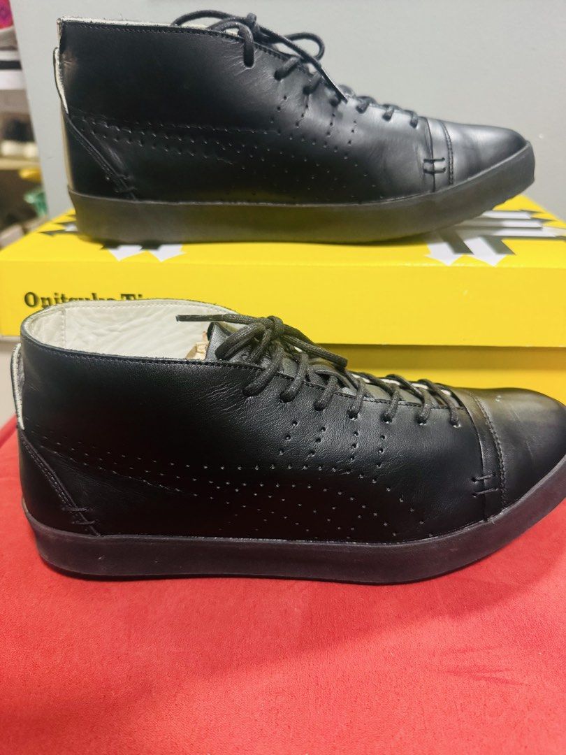 Onitsuka Tiger Black Leather Mid-Top Sneakers (Category: Sneakers) located in Quezon City. Submitted by TGDL123 (Listing ID 1442268371, Image 2). Description: - Brand: Onitsuka Tiger - Style: Mid-top sneakers - Color: Black - Material: Leather upper, rubber sole - Origin: Made in Japan - Size: 24cm (US 5.5 / Euro 38) - Condition: Comes with original box - Perfect for: Casual wear -Preloved.