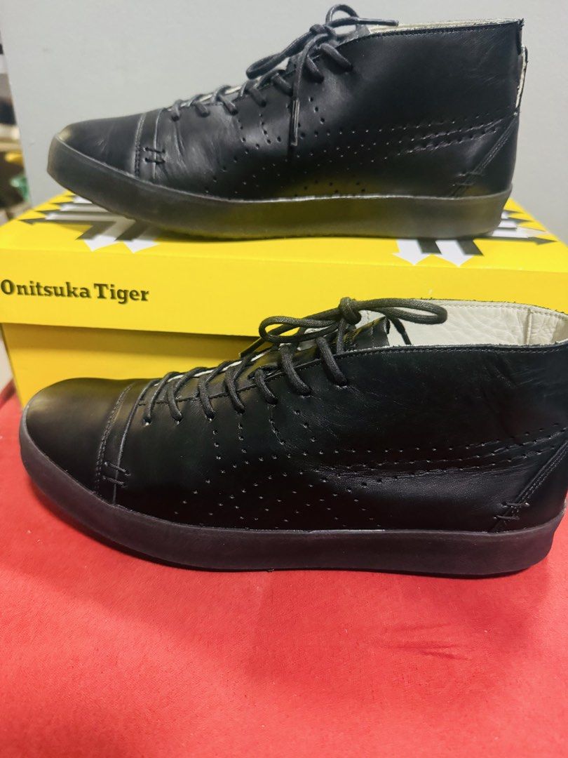 Onitsuka Tiger Black Leather Mid-Top Sneakers (Category: Sneakers) located in Quezon City. Submitted by TGDL123 (Listing ID 1442268371, Image 1). Description: - Brand: Onitsuka Tiger - Style: Mid-top sneakers - Color: Black - Material: Leather upper, rubber sole - Origin: Made in Japan - Size: 24cm (US 5.5 / Euro 38) - Condition: Comes with original box - Perfect for: Casual wear -Preloved.