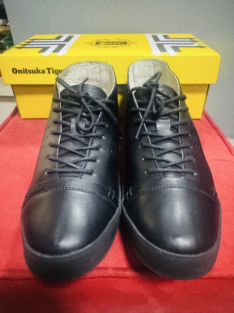Onitsuka Tiger Black Leather Mid-Top Sneakers (Category: Sneakers) located in Quezon City. Submitted by TGDL123 (Listing ID 1442268371, Image 3). Description: - Brand: Onitsuka Tiger - Style: Mid-top sneakers - Color: Black - Material: Leather upper, rubber sole - Origin: Made in Japan - Size: 24cm (US 5.5 / Euro 38) - Condition: Comes with original box - Perfect for: Casual wear -Preloved.