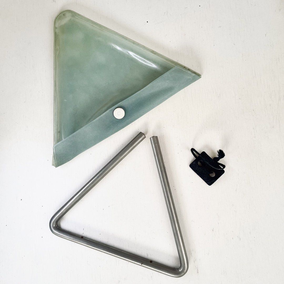 Orchestral Musical Triangle Instrument with Holder & Case Percussion (Category: Musical Instruments) located in Tagaytay City. Submitted by barenwolf (Listing ID 1442321829, Image 3). Description: Selling a pre-loved metal musical triangle percussion instrument, perfect for students, school bands, church choirs, or multi-instrumentalists looking to expand their sound effects kit! It produces a bright, clear, and resonant ringing tone. Comes as a 