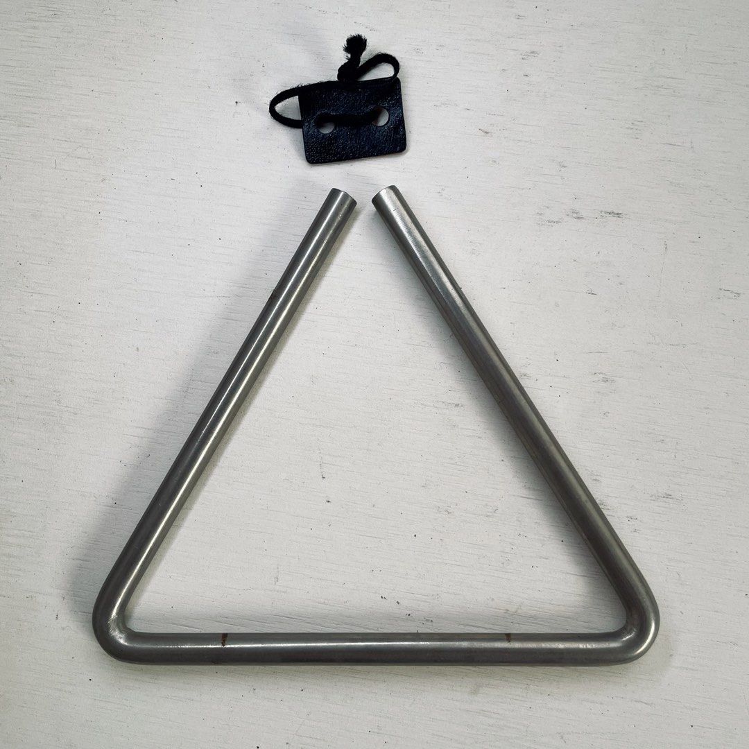 Orchestral Musical Triangle Instrument with Holder & Case Percussion (Category: Musical Instruments) located in Tagaytay City. Submitted by barenwolf (Listing ID 1442321829, Image 2). Description: Selling a pre-loved metal musical triangle percussion instrument, perfect for students, school bands, church choirs, or multi-instrumentalists looking to expand their sound effects kit! It produces a bright, clear, and resonant ringing tone. Comes as a 