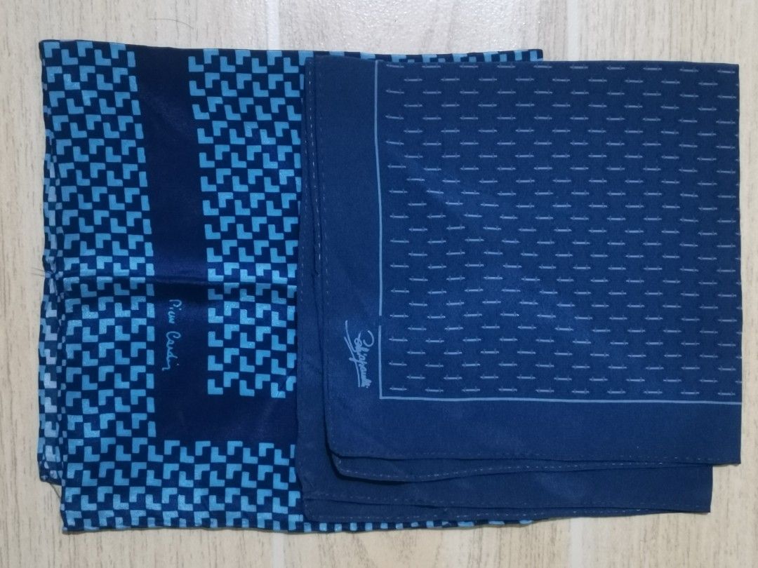Pierre Cardin & Schiaparelli Pocket Squares Set (Category: Sets or Coordinates) located in San Pablo. Submitted by somariaj (Listing ID 1442269292, Image 3). Description: - Two designer pocket squares - Color: Dark Blue - Brand 1: Pierre Cardin (geometric pattern) - Brand 2: Schiaparelli (small pattern) - Adds a touch of class to any outfit Pierre Cardin 14x15 Schiaparelli 13x13.