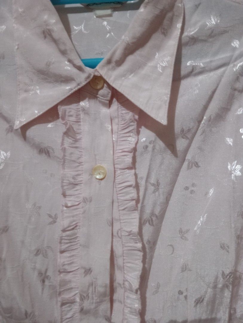 Pink Floral Long Sleeve Button Up Blouse (Category: Blouses) located in Makati City. Submitted by YSL80022 (Listing ID 1442203306, Image 3). Description: - Light pink satin blouse - Subtle floral pattern, jacquard - Ruffle detail down the front placket - Button closure - Long sleeves with buttoned cuffs - Dressy style, suitable for work or a night out RFS: weight gain.