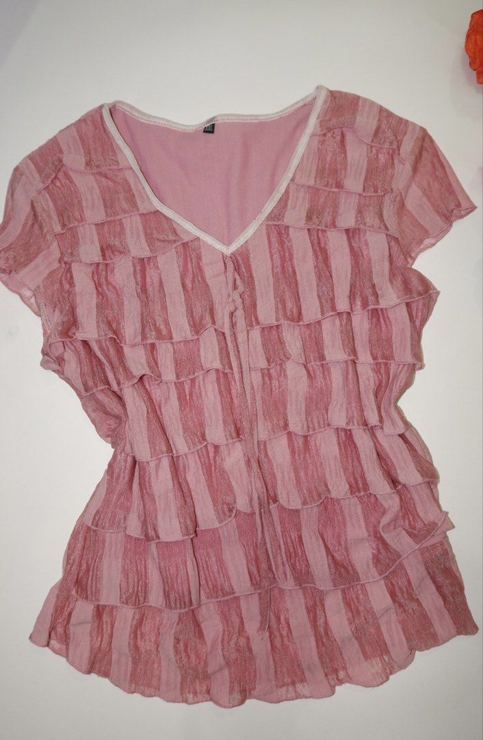 Pink Ruffle V-Neck Short Sleeve Top (Category: Blouses) located in Pasig City. Submitted by mjca29 (Listing ID 1442236581, Image 1). Description: Pink top with charming all-over ruffles. The size on tag is not accurate. Size: Small *Manage your expectation. Pre-loved item *Color may vary due to lighting SF will shouldered by buyer .
