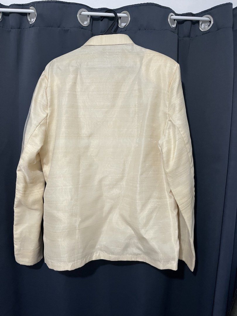 Pinya Organza XL Barong (Category: Formal Shirts) located in Manila. Submitted by justodile (Listing ID 1442283337, Image 3). Description: - Pinya OrganzaCream-colored Barong Tagalog shirt - Size XL - Intricate embroidery on the front - Long sleeves with button cuffs - Mandarin collar with button closure - Made from a textured fabric - Ideal for formal events and cultural celebrations For rent: 800.
