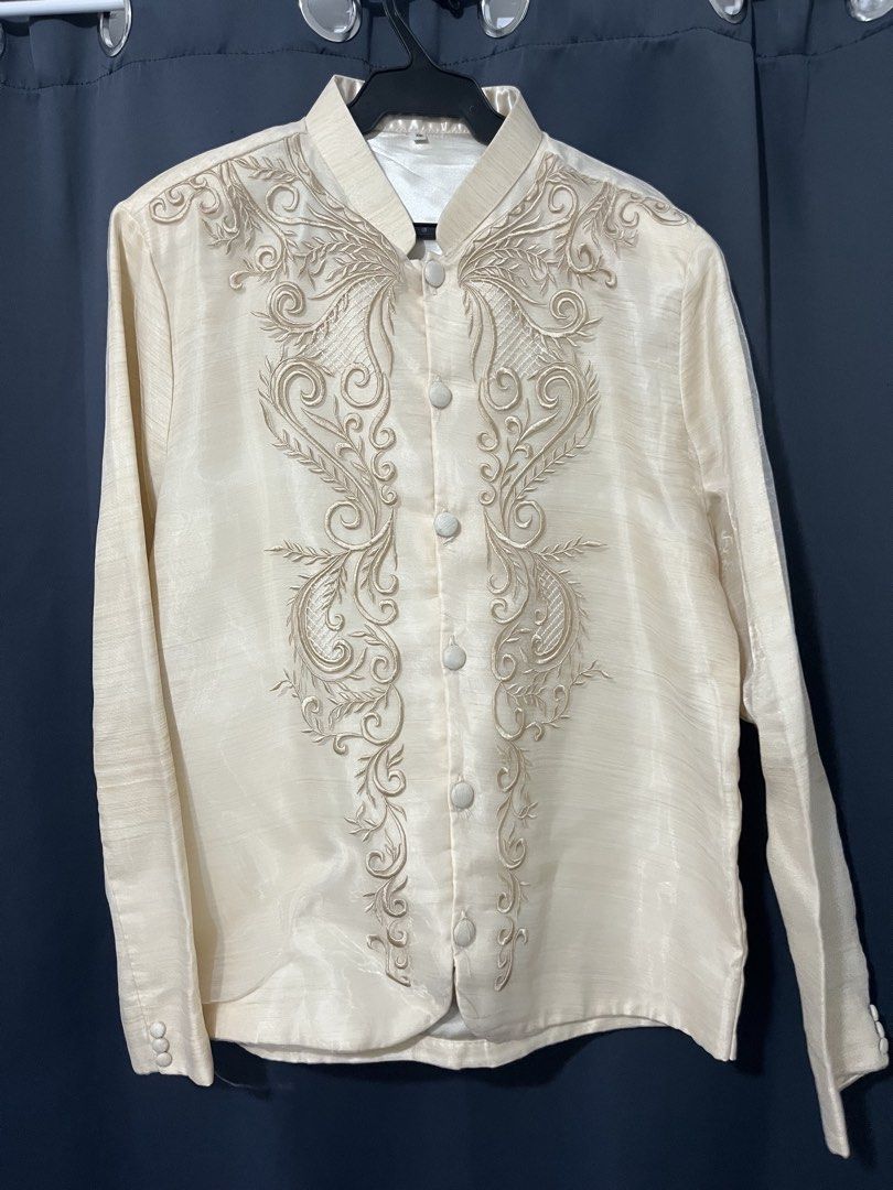 Pinya Organza XL Barong (Category: Formal Shirts) located in Manila. Submitted by justodile (Listing ID 1442283337, Image 2). Description: - Pinya OrganzaCream-colored Barong Tagalog shirt - Size XL - Intricate embroidery on the front - Long sleeves with button cuffs - Mandarin collar with button closure - Made from a textured fabric - Ideal for formal events and cultural celebrations For rent: 800.