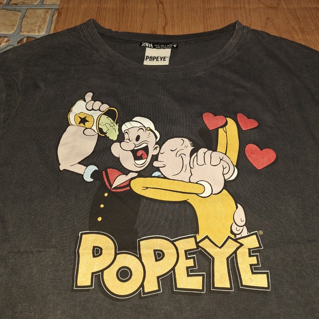 PopEye X Zara Tee (Category: Tshirts & Polo Shirts ) located in Aroroy. Submitted by rewear_r3volution (Listing ID 1442331871, Image 2). Description: This Zara brand t-shirt features a vintage-style graphic of Popeye the Sailor and Olive Oyl..