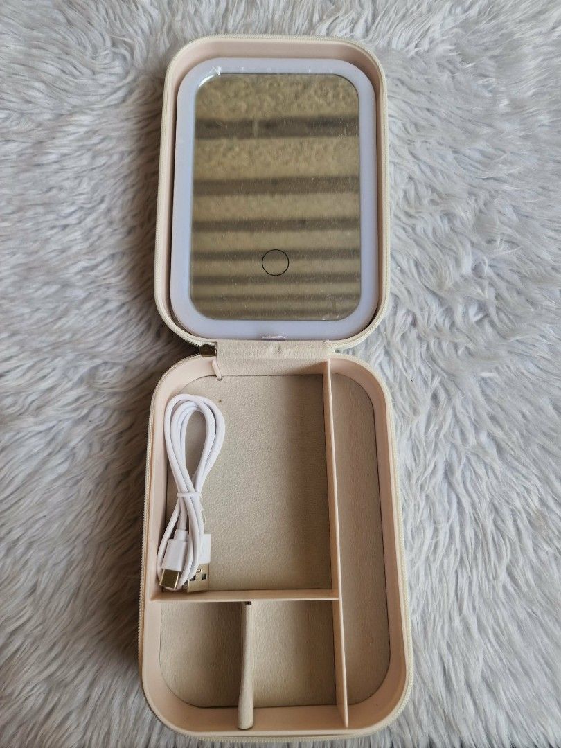 Portable Vanity Kit Mirror (White) (Category: Makeup) located in Quezon City. Submitted by floreskari78555 (Listing ID 1442272816, Image 2). Description: Portable Vanity Kit Mirror (White) Pu leather (smooth)✅ LED Ring Light✅ Encircles the mirror to provide shadow-free, even facial illumination. Smart Touch Dimmer✅Central touch button controls the light power and adjustable brightness. Storage Compartments✅ Divided lower tray neatly separates jew