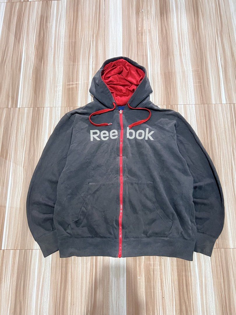 Reebok Grey Zip-Up Hoodie with Red Lining (Category: Hoodies) located in Manila. Submitted by indicough_03 (Listing ID 1442183211, Image 1). Description: - Grey Reebok zip-up hoodie - Red lining inside hood and pockets - Red drawstrings for hood - Front pockets - Ideal for casual wear or workouts - Easy to layer.