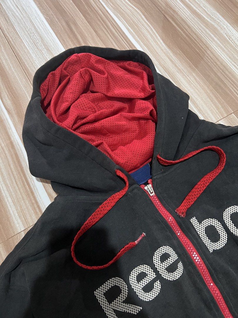 Reebok Grey Zip-Up Hoodie with Red Lining (Category: Hoodies) located in Manila. Submitted by indicough_03 (Listing ID 1442183211, Image 2). Description: - Grey Reebok zip-up hoodie - Red lining inside hood and pockets - Red drawstrings for hood - Front pockets - Ideal for casual wear or workouts - Easy to layer.