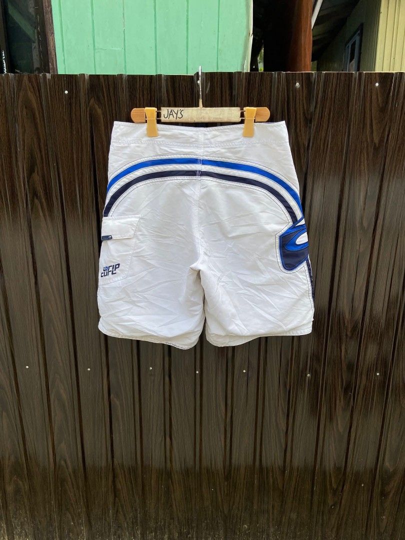 Rip Curl White Blue Striped Board Shorts (Category: Swim Trunks & Board Shorts) located in Manila. Submitted by thebrothrift (Listing ID 1442302272, Image 2). Description: - White Rip Curl board shorts - Blue and black stripe design - Elastic waistband with drawstring - Velcro pocket on the back - Ideal for swimming or lounging VINTAGE RUPCURL BOARD SHORTS🥶 WAISTLINE:32-33 LENGTH:19 EXCELLENT CONDITION NO ISSUE❌ NEED WASH 2500💵.