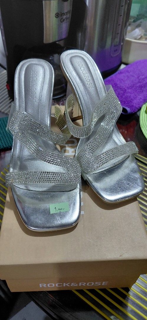 Rock & Rose Silver Embellished Block Heels (Category: Heels) located in Manila. Submitted by snowice08 (Listing ID 1442303566, Image 1). Description: - Silver sandals with sparkly straps - Trendy square toe design - Chunky clear block heel for added height - Perfect for elevating any outfit - Size 37 - Includes original box and tissue paper.