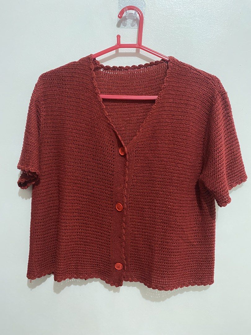Rust Red Crochet Button-Up Short Sleeve Cardigan (Category: Coats, Jackets and Outerwear) located in Davao. Submitted by mskoiii (Listing ID 1442260054, Image 1). Description: - Cute rust red crochet cardigan - Short sleeves with scalloped hem - V-neck with button-up front - Intricate and airy crochet pattern - Ideal for layering over tops or dresses - Adds color and texture to outfits -Appears darker than in the photos.