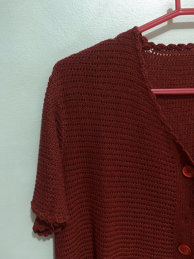 Rust Red Crochet Button-Up Short Sleeve Cardigan (Category: Coats, Jackets and Outerwear) located in Davao. Submitted by mskoiii (Listing ID 1442260054, Image 2). Description: - Cute rust red crochet cardigan - Short sleeves with scalloped hem - V-neck with button-up front - Intricate and airy crochet pattern - Ideal for layering over tops or dresses - Adds color and texture to outfits -Appears darker than in the photos.