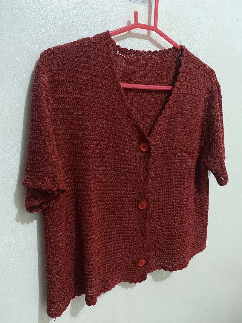 Rust Red Crochet Button-Up Short Sleeve Cardigan (Category: Coats, Jackets and Outerwear) located in Davao. Submitted by mskoiii (Listing ID 1442260054, Image 3). Description: - Cute rust red crochet cardigan - Short sleeves with scalloped hem - V-neck with button-up front - Intricate and airy crochet pattern - Ideal for layering over tops or dresses - Adds color and texture to outfits -Appears darker than in the photos.