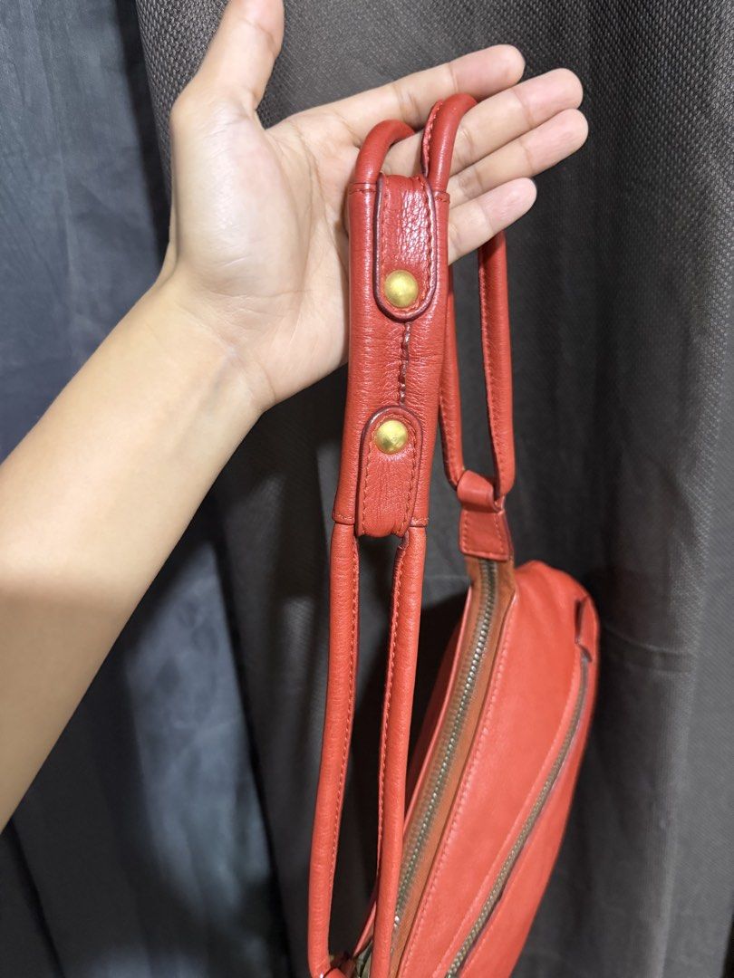 Salvatore Ferragamo Red Leather (Category: Luxury Bags & Wallets) located in Manila. Submitted by rubyjaneba27331 (Listing ID 1442274215, Image 2). Description: Iconic Gancini hardware and tassel detail Secure zipper closure With dust bag Loc: upper Antipolo.