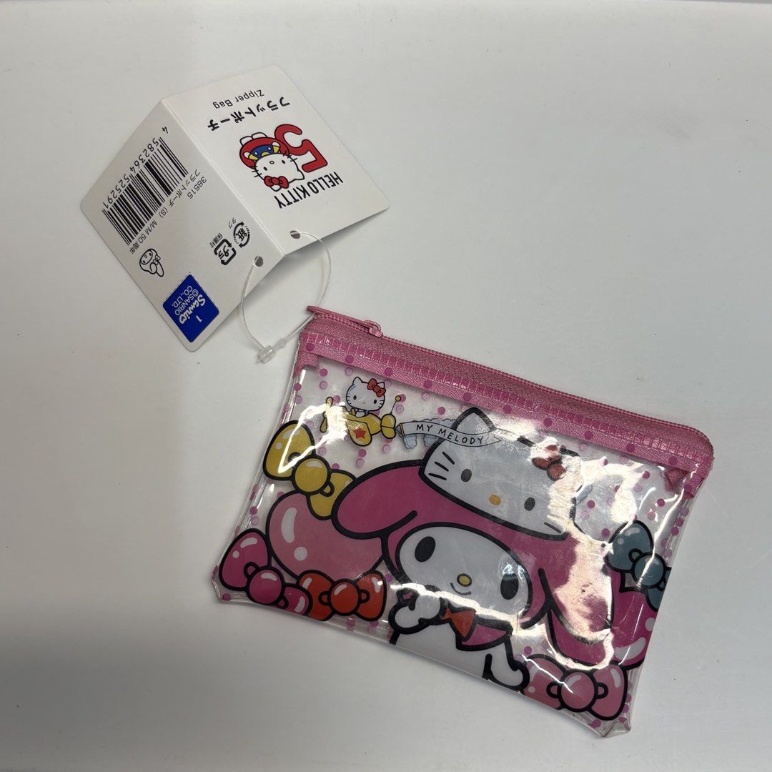 Sanrio My Melody x Hello Kitty Wallet (Category: Purses & Pouches) located in Manila. Submitted by buttern0t (Listing ID 1442335858, Image 1). Description: 💌 for proof of transactions & safekeeping of items , dm us on IG @dara.aniks / @puffyberries ✮⋆˙.