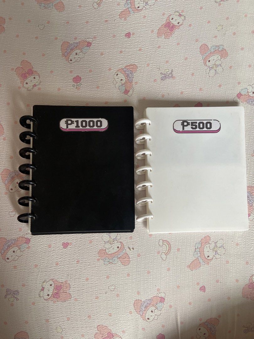 Savings Binder / Card Holder (Category: Stationery & School Supplies) located in Malolos. Submitted by eeveefinds (Listing ID 1442231411, Image 1). Description: - Set of 2 binder-style photo albums fixed at PHP 100 - payment first policy - payment methods: gcash / bpi - shipping via j&t / lalamove - shipping shouldered by buyer 📍Malolos, Bulacan .