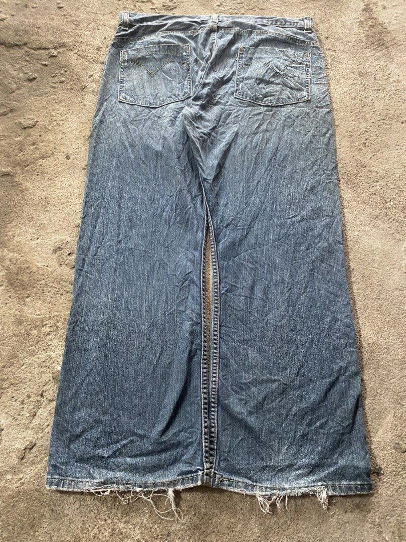 Silver Tab Levi's Wide Leg Jeans (Category: Jeans) located in Caloocan City. Submitted by remythrift (Listing ID 1442222200, Image 1). Description: - Classic blue denim jeans - Wide leg cut for a relaxed fit - Trendy distressed hem detail - Secure button and zip closure - Two back pockets with signature stitching - Versatile staple piece for any casual outfit.
