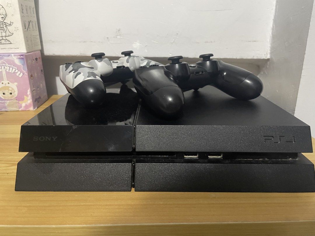 Sony PlayStation 4 Console Fat 1Tb (Category: PlayStation) located in Quezon City. Submitted by rnch444 (Listing ID 1442189171, Image 3). Description: - Black Sony PlayStation 4 console - Two DualShock 4 controllers (1 black, 1 grey camouflage) - Power cable included - Fat Model - 1 Terabyte - HDMI not included dm for more.