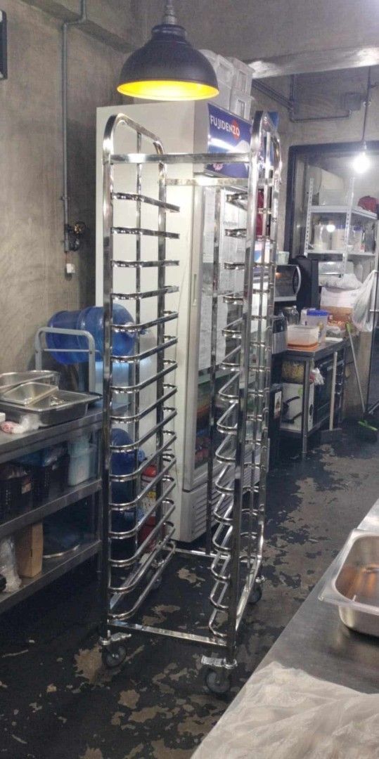 Stainless Steel Baking Rack with Wheels (Category: Bakeware) located in Manila. Submitted by acykt18 (Listing ID 1442337152, Image 1). Description: - Heavy duty stainless steel construction - Multiple shelves for trays - Smooth rolling wheels for easy transport - Ideal for bakeries and commercial kitchens - Durable and built to last - Ready for a new home.