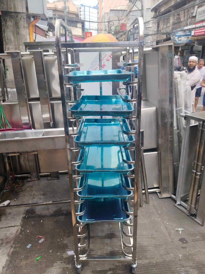 Stainless Steel Baking Rack with Wheels (Category: Bakeware) located in Manila. Submitted by acykt18 (Listing ID 1442337152, Image 2). Description: - Heavy duty stainless steel construction - Multiple shelves for trays - Smooth rolling wheels for easy transport - Ideal for bakeries and commercial kitchens - Durable and built to last - Ready for a new home.