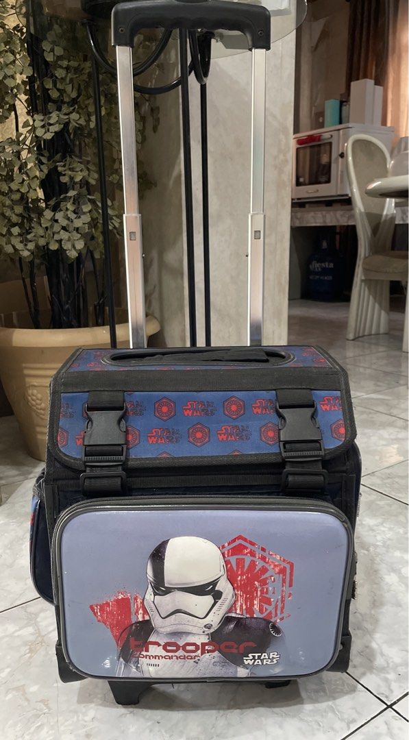 Star Wars school trolley bag (Category: Babies & Kids Fashion) located in Cainta. Submitted by j.c.v_68 (Listing ID 1442241293, Image 1). Description: School trolley Comes with bag rain coat, water bottle/umbrella side pocket, 4-zipped pockets, main compartment for books/notebooks, front pocket, side pocket and back pocket. Issues: front stand extension one side broken & stand (doesn’t affect the bag when stands) please see pictures Wheels are pe