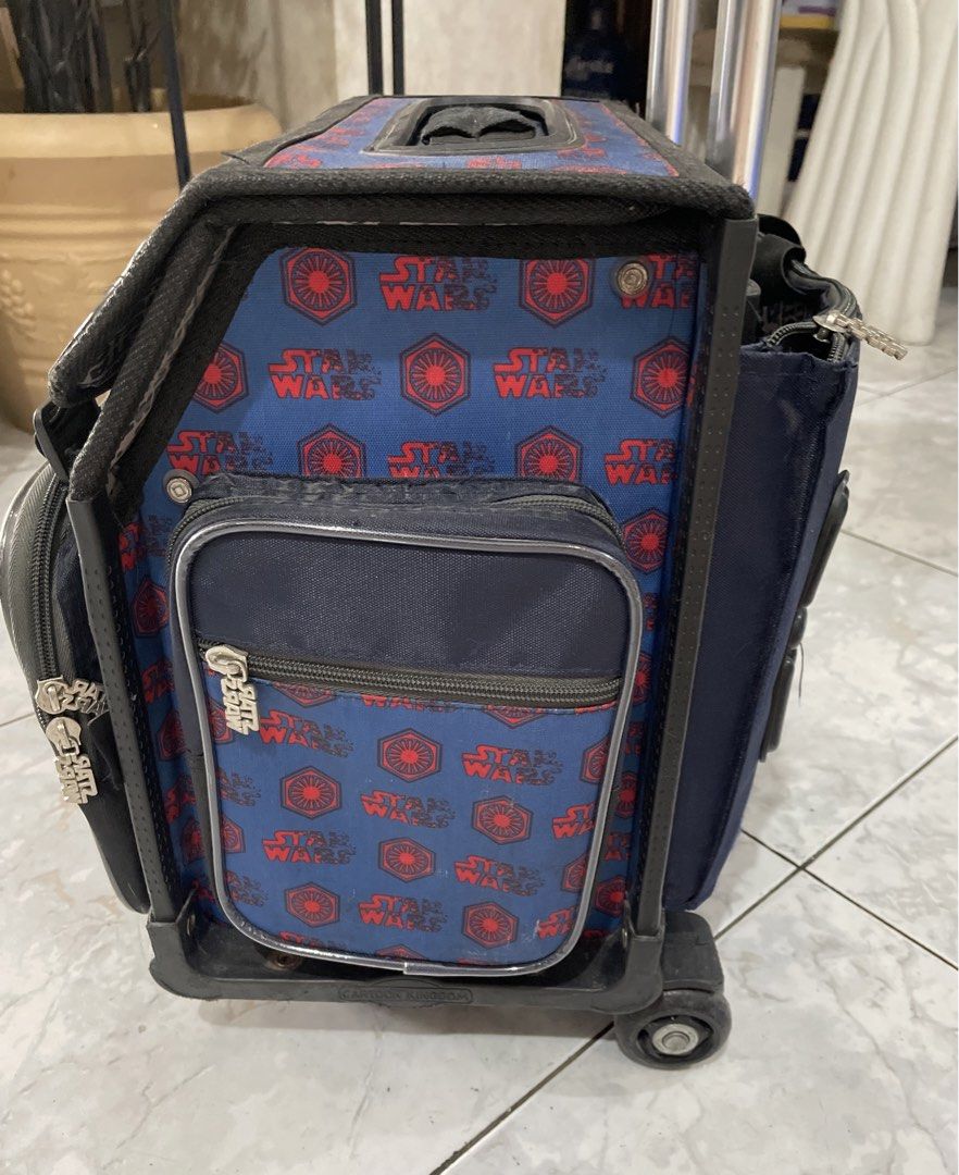Star Wars school trolley bag (Category: Babies & Kids Fashion) located in Cainta. Submitted by j.c.v_68 (Listing ID 1442241293, Image 2). Description: School trolley Comes with bag rain coat, water bottle/umbrella side pocket, 4-zipped pockets, main compartment for books/notebooks, front pocket, side pocket and back pocket. Issues: front stand extension one side broken & stand (doesn’t affect the bag when stands) please see pictures Wheels are pe